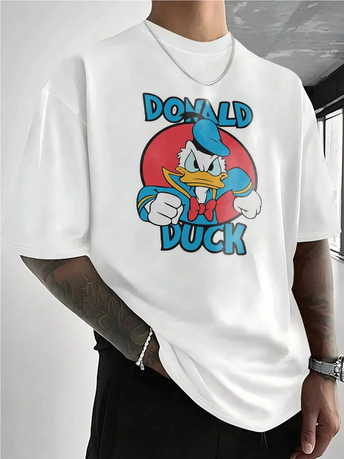 Disney Donald Duck Graphic Men's T-Shirt Summer Cartoon Funny Printed Cotton Short Sleeve Unisex T Shirt Casual Tops Clothing
Disney Donald Duck Graphic Men's T-Shirt Summer Cartoon Funny Printed Cotton Short Sleeve Unisex T Shirt Casual Tops Clothing