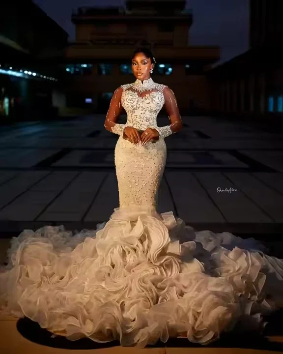 Customized High Collar Beads Crystals Arabic Aso Ebi Wedding Dress for Bride Long Sleeves Tiered Ruffles Bridal Gowns
Customized High Collar Beads Crystals Arabic Aso Ebi Wedding Dress for Bride Long Sleeves Tiered Ruffles Bridal Gowns