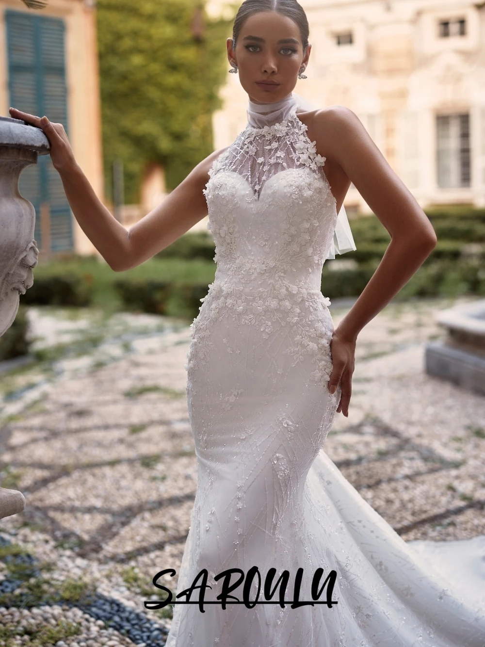 Свадебное платье SAROULU: романтичное, цветочное, элегантное, с вырезом халтер, силуэт «русалка», на заказ, роскошное, с ослепительными жемчужинами, корсетное, для невесты
Свадебное платье SAROULU: романтичное, цветочное, элегантное, с вырезом халтер, силуэт «русалка», на заказ, роскошное, с ослепительными жемчужинами, корсетное, для невесты
