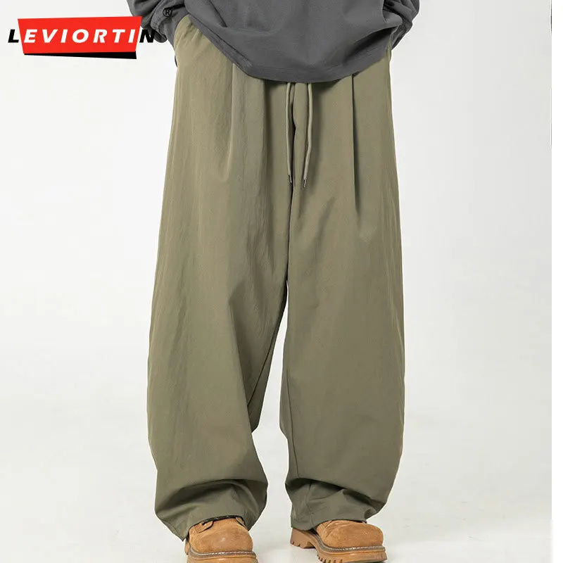 Men's 2025 Spring Edition pleated design curved knife casual pants retro loose trendy brand micro retractable drawstring pants
Men's 2025 Spring Edition pleated design curved knife casual pants retro loose trendy brand micro retractable drawstring pants