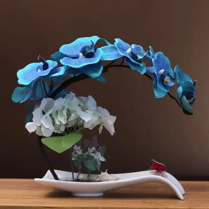 Phalaenopsis simulation fake flower flower set decoration European living room TV cabinet table silk flower decoration
Phalaenopsis simulation fake flower flower set decoration European living room TV cabinet table silk flower decoration