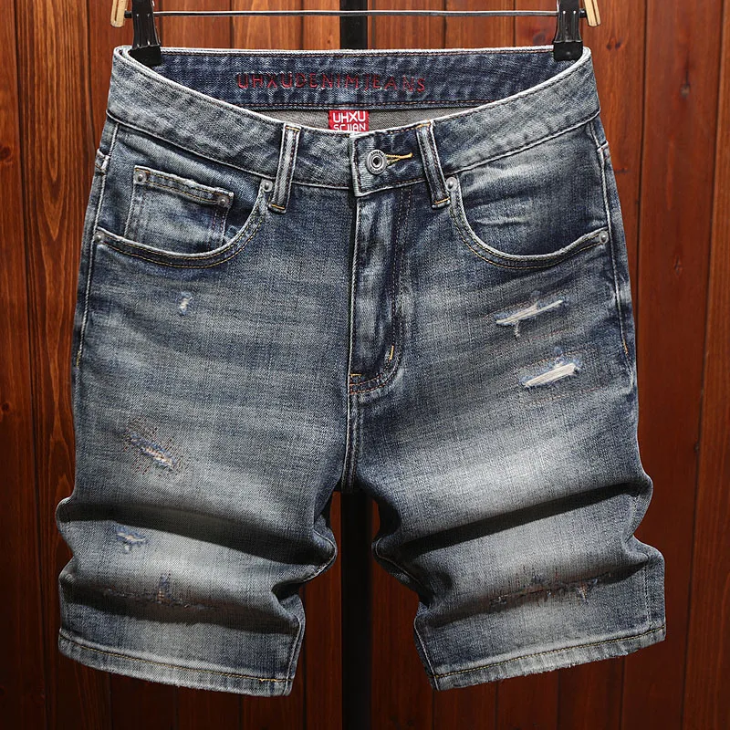High end summer denim shorts for men with perforated patches, trendy fashion, casual, retro and nostalgic five quarter pants
High end summer denim shorts for men with perforated patches, trendy fashion, casual, retro and nostalgic five quarter pants