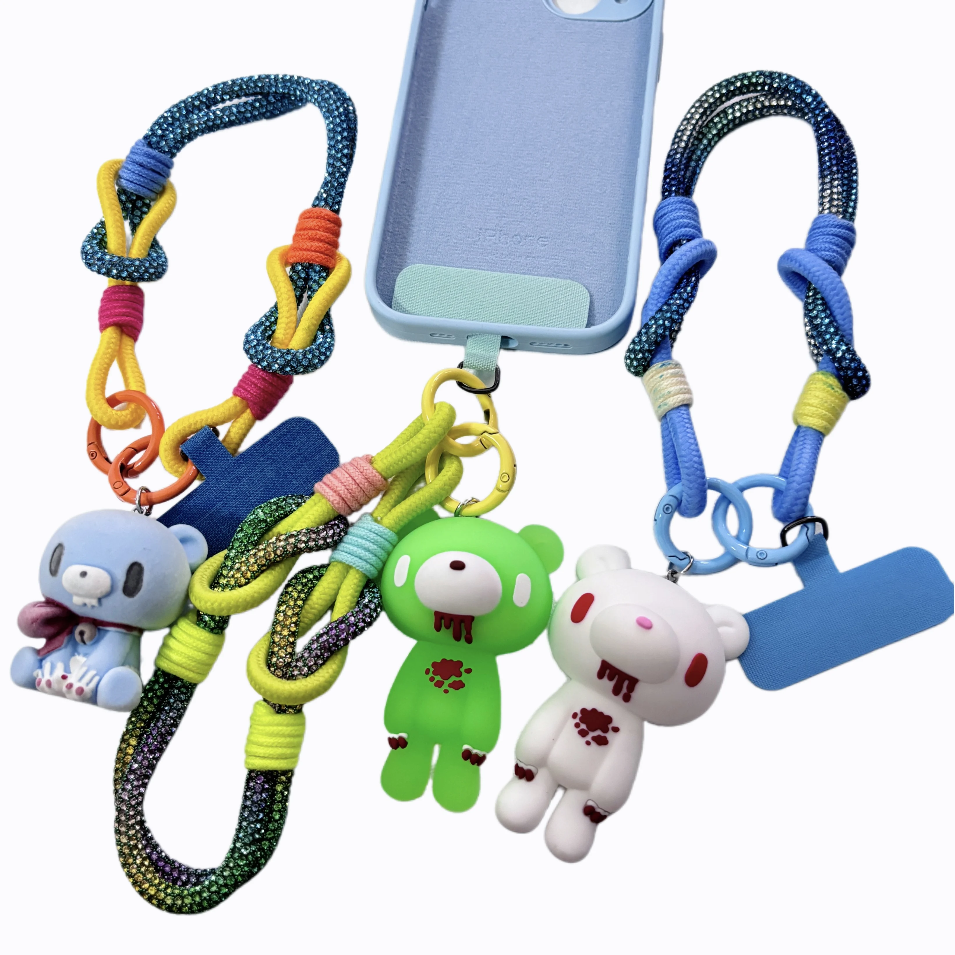 Edgy Bear Charm Phone Straps - Featuring Colorful Braided Straps with Unique Bloody Bear Charms in Green, White, and Blue
Edgy Bear Charm Phone Straps - Featuring Colorful Braided Straps with Unique Bloody Bear Charms in Green, White, and Blue