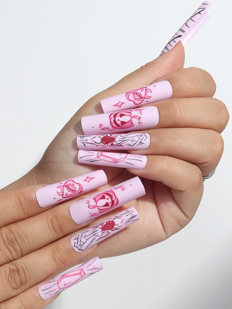 Upgrade Your Style for Halloween with This 24 Piece Long Coffin Shaped Graffiti Pumpkin and Spider Patterned Nail Art Set
Upgrade Your Style for Halloween with This 24 Piece Long Coffin Shaped Graffiti Pumpkin and Spider Patterned Nail Art Set
