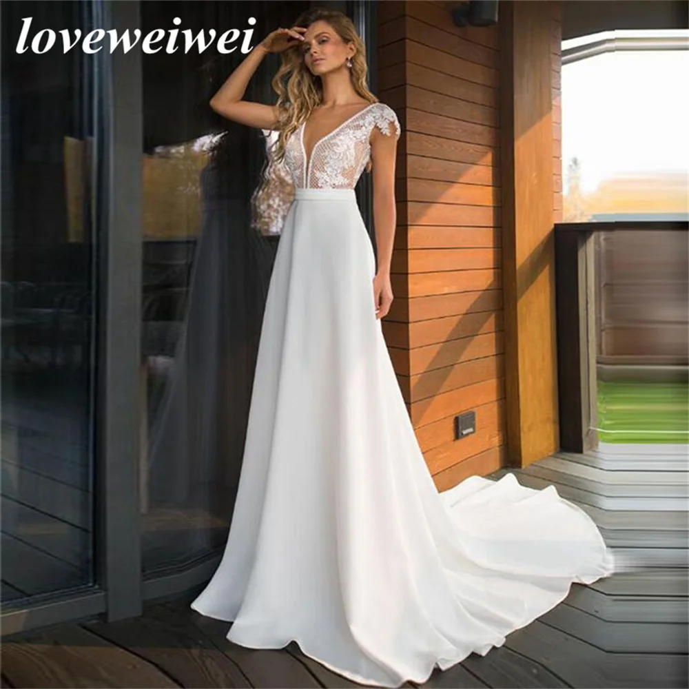 Boho Deep V-Neck Satin Wedding Dress 2022 Elegant Lace Appliques A-Line Cap Sleeves Floor Length Backless Bridal Gown Plus Size
Boho Deep V-Neck Satin Wedding Dress 2022 Elegant Lace Appliques A-Line Cap Sleeves Floor Length Backless Bridal Gown Plus Size