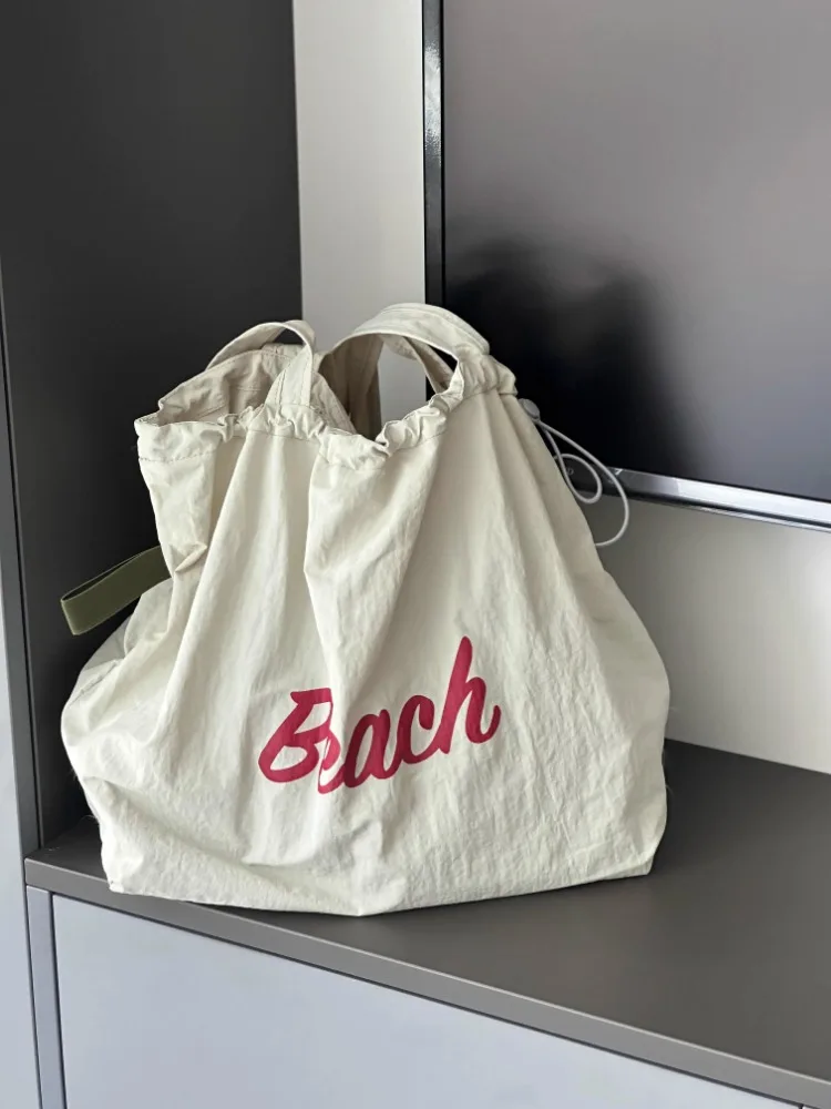 Drawstring Korean Letters Shoulder Bag Large Capacity Underarm Bag Summer Fairy Student Canvas Bag Open Female Fashion
Drawstring Korean Letters Shoulder Bag Large Capacity Underarm Bag Summer Fairy Student Canvas Bag Open Female Fashion