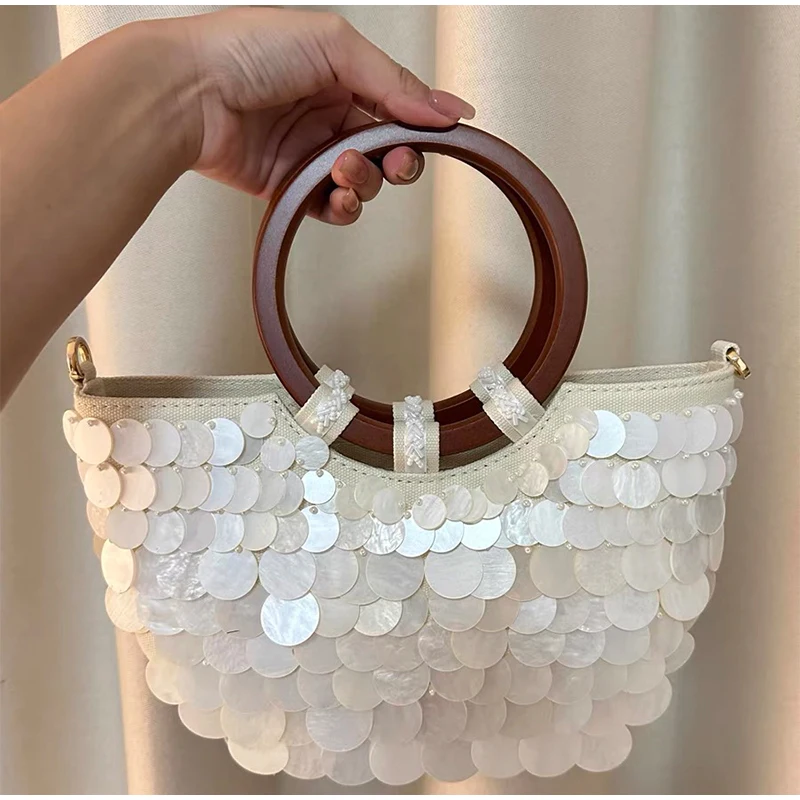 Handmade Pearlescent Shell Handbag Boho Half-moon-shaped Exquisite Purse With Chain Crossbody Bag Summer Round Handles Beach Bag
Handmade Pearlescent Shell Handbag Boho Half-moon-shaped Exquisite Purse With Chain Crossbody Bag Summer Round Handles Beach Bag