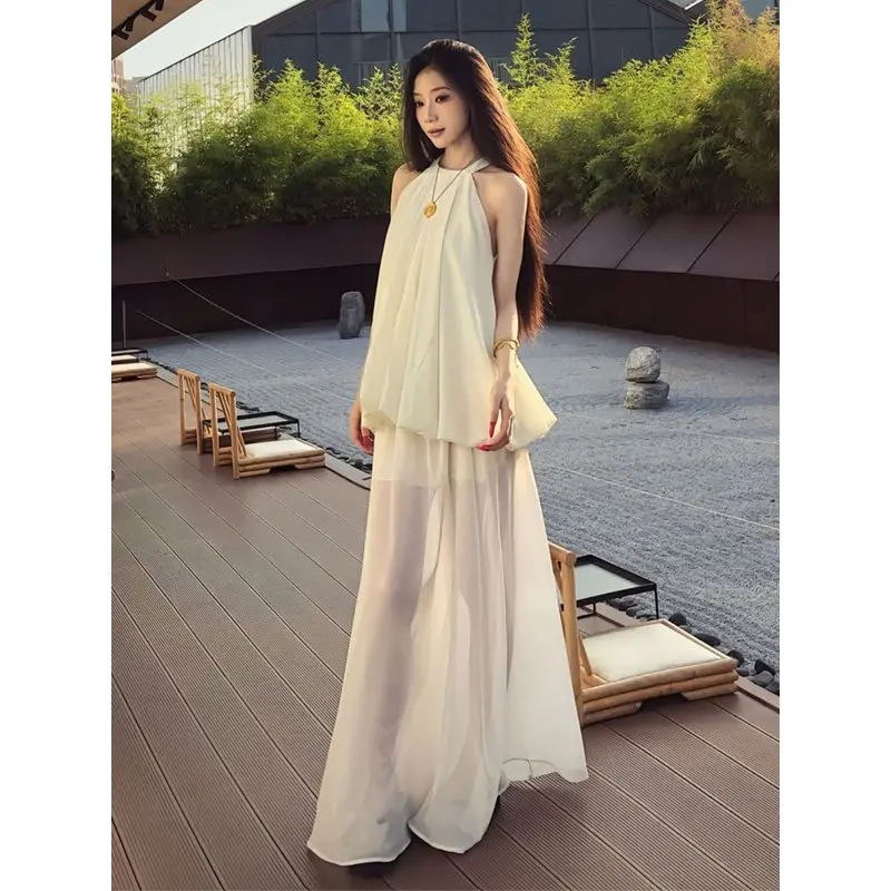 French Gentle Style White Hanging Neck Suspender Dress 2026 Summer New Vacation Style Long Skirt Set
French Gentle Style White Hanging Neck Suspender Dress 2026 Summer New Vacation Style Long Skirt Set