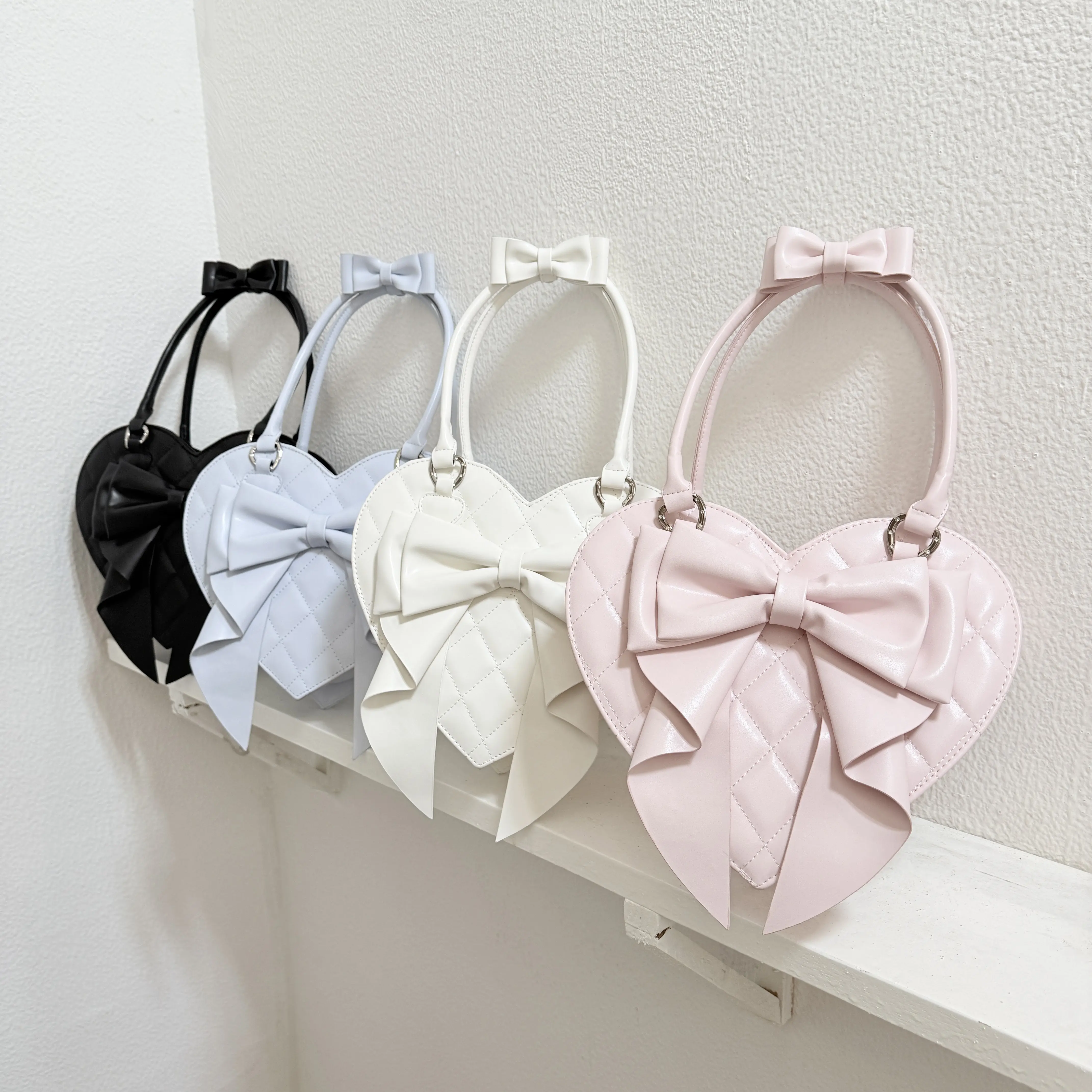2026 Summer New Japanese Original Sweet and Cute Lolita Bow Love Bag Soft Girl Lo Mother Shoulder Handbag for Women
2026 Summer New Japanese Original Sweet and Cute Lolita Bow Love Bag Soft Girl Lo Mother Shoulder Handbag for Women