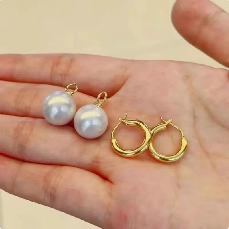 Extra large and minimalist AAAA natural 10-11mm South Sea round white pearl earrings in 14k gold
Extra large and minimalist AAAA natural 10-11mm South Sea round white pearl earrings in 14k gold