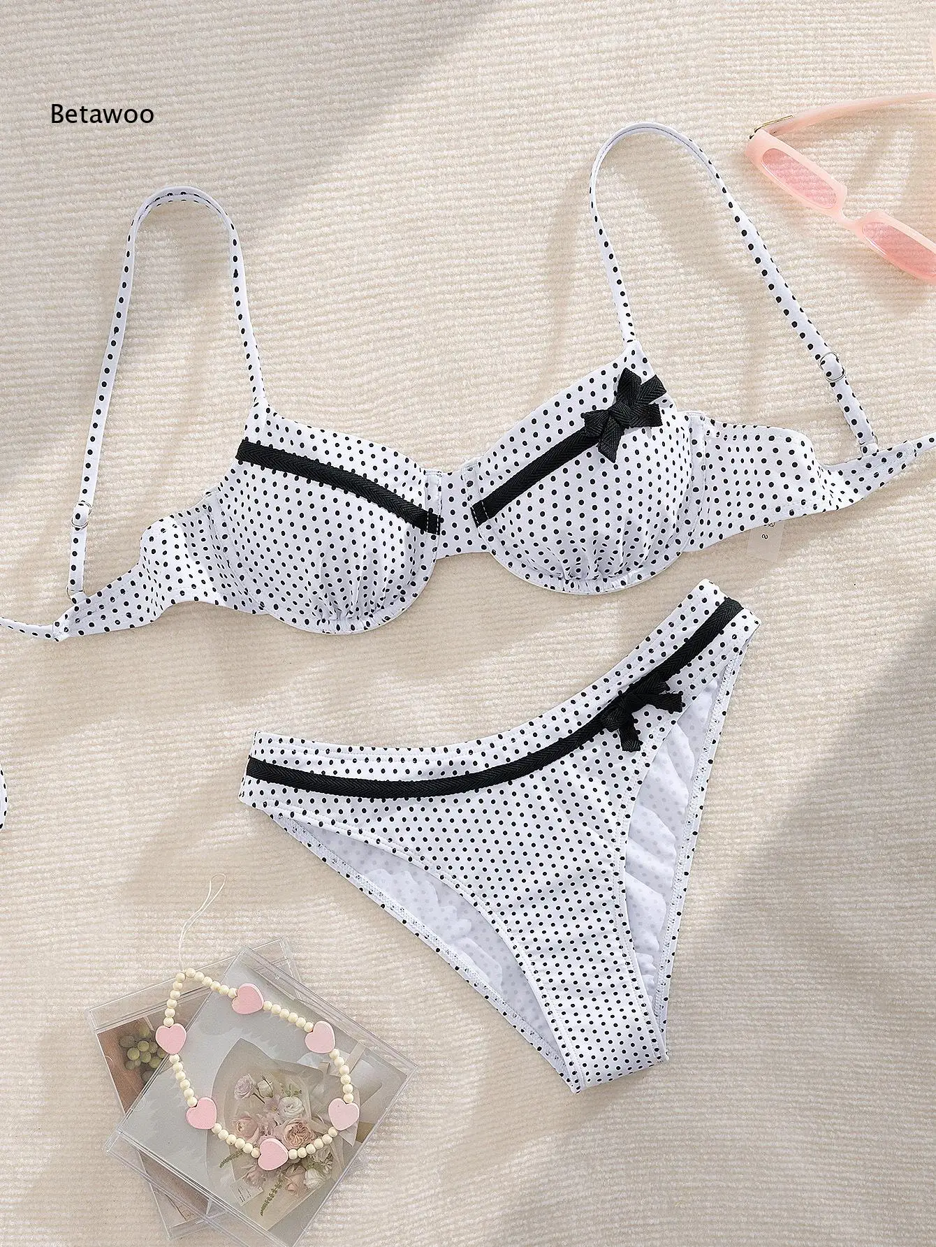 Retro Polka Dot Two-Piece Bikini with Black Bow Accent
Retro Polka Dot Two-Piece Bikini with Black Bow Accent