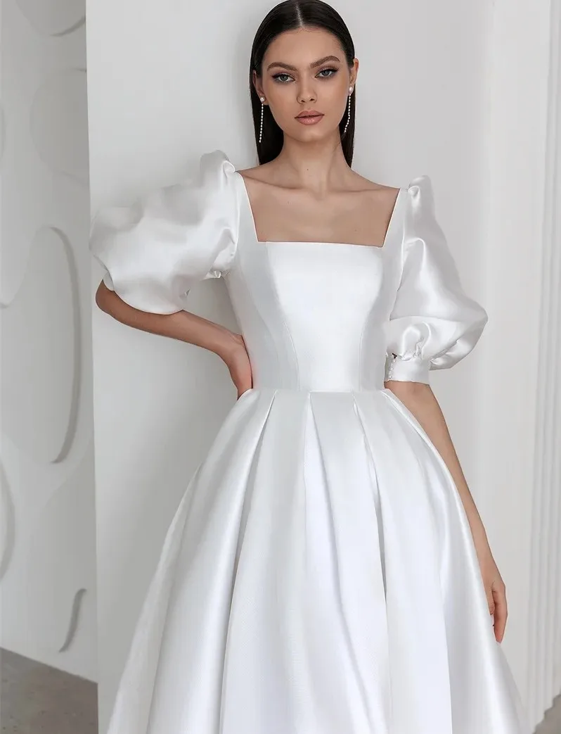 2025 Elegant A-ine Princess Wedding Dresses Square Neck Short Puff Sleeves Satin Bridal Party Gown Robe De Mariage
2025 Elegant A-ine Princess Wedding Dresses Square Neck Short Puff Sleeves Satin Bridal Party Gown Robe De Mariage