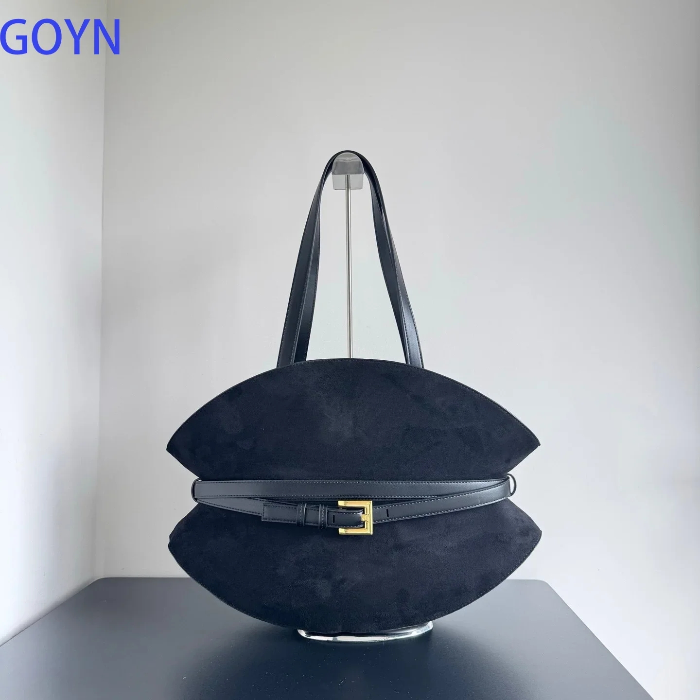 Minimalist Vibe Black Suede Shell Shaped Tote Bag with Gold Buckle Hardware
Minimalist Vibe Black Suede Shell Shaped Tote Bag with Gold Buckle Hardware