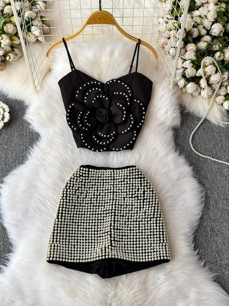 2025 Summer Three Dimensional Flower Pearl Strap Top High Waist Slimming Shorts Elegant Temperament Two Piece Set
2025 Summer Three Dimensional Flower Pearl Strap Top High Waist Slimming Shorts Elegant Temperament Two Piece Set