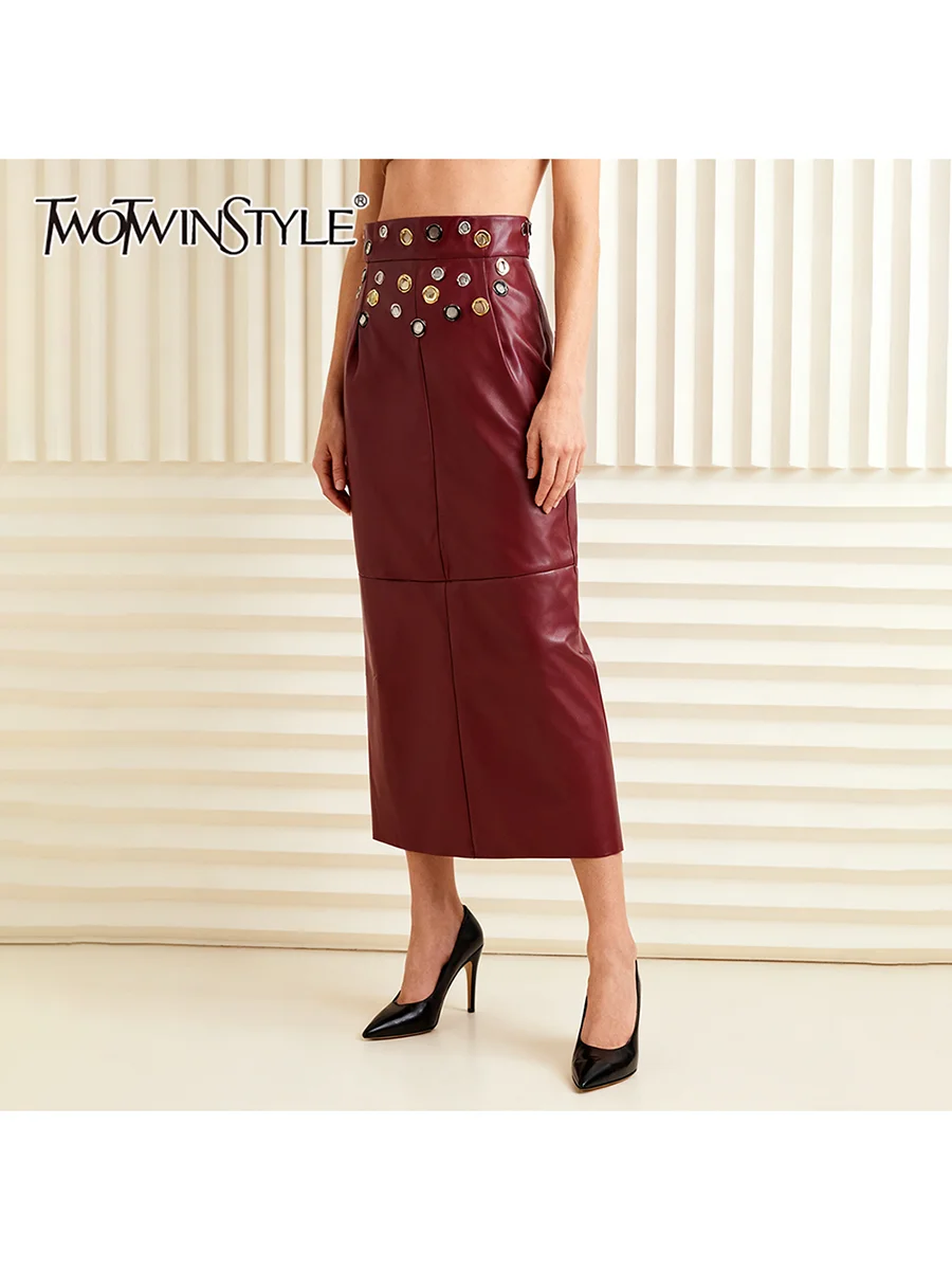 TWOTWINSTYLE Solid Slimming Spliced Metal Ring Elegant Long Skirts for Women High Waist Fashion Leather Skirt Female Clothing
TWOTWINSTYLE Solid Slimming Spliced Metal Ring Elegant Long Skirts for Women High Waist Fashion Leather Skirt Female Clothing