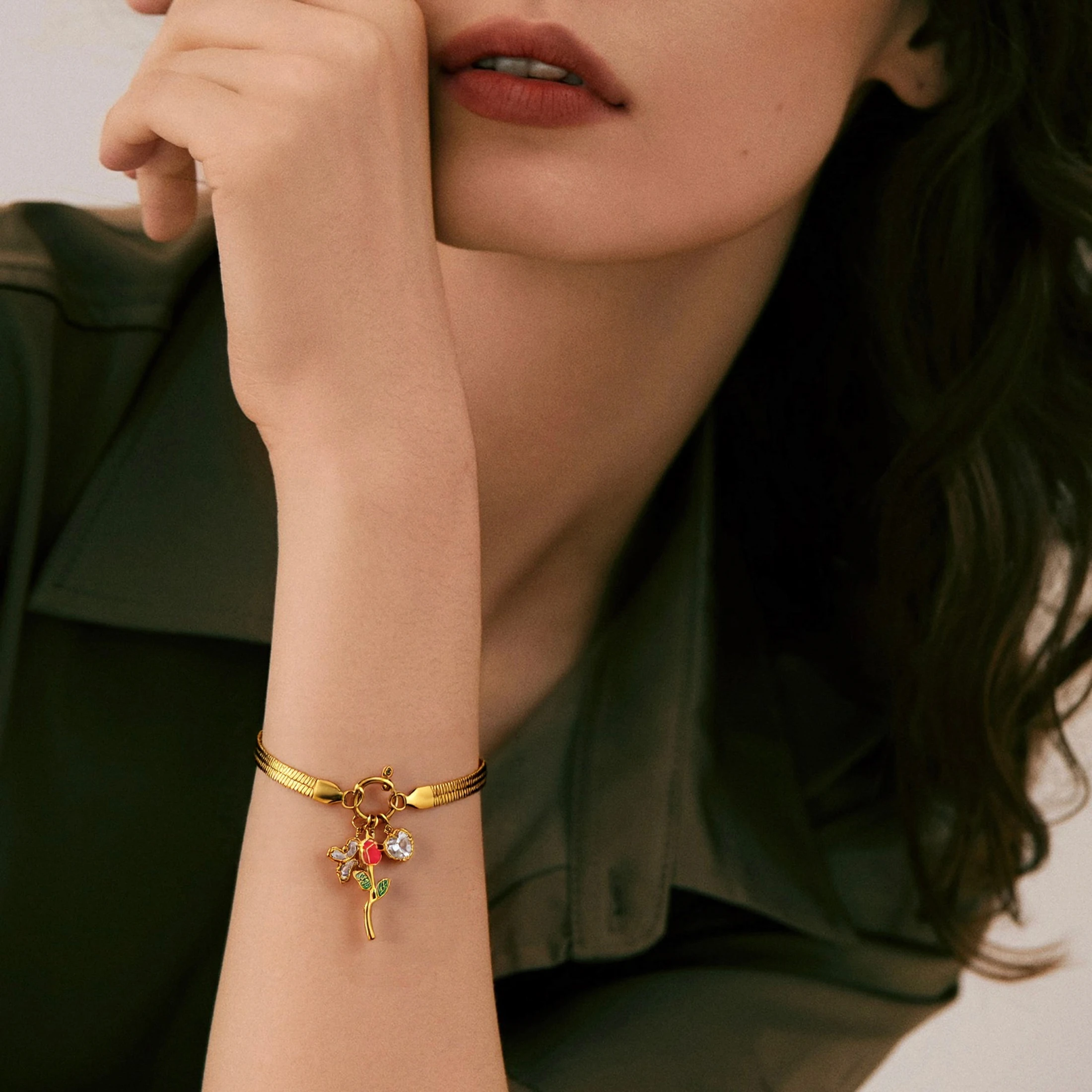 Golden Tone Stainless Steel Herringbone Bracelet with Rose and Synthetic Zirconia Charms for Women
Golden Tone Stainless Steel Herringbone Bracelet with Rose and Synthetic Zirconia Charms for Women