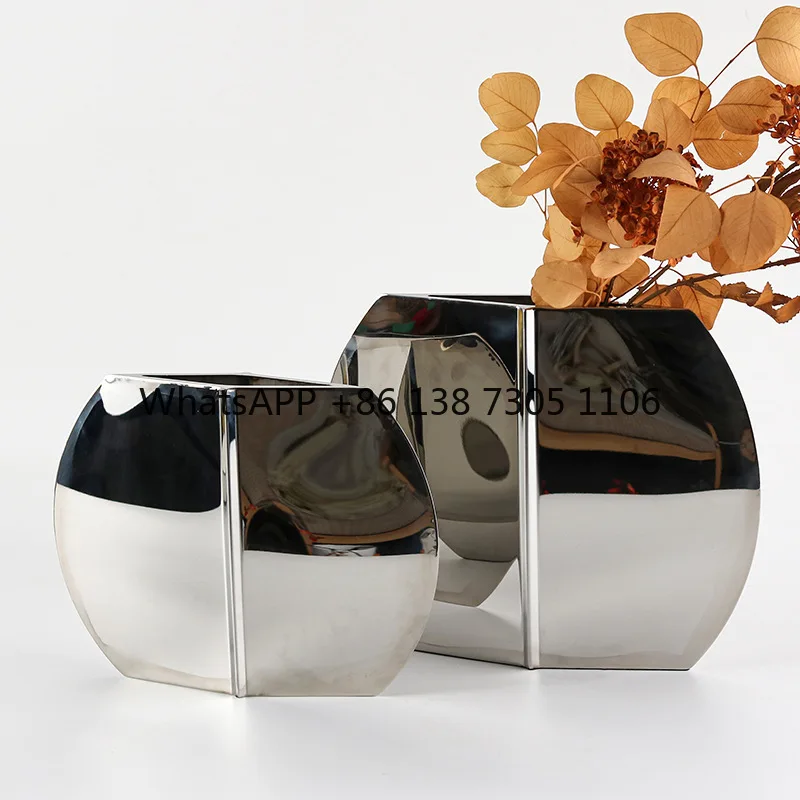 Nordic simple living room ornament flower arrangement stainless steel big belly vase light luxury sales office decoration
Nordic simple living room ornament flower arrangement stainless steel big belly vase light luxury sales office decoration