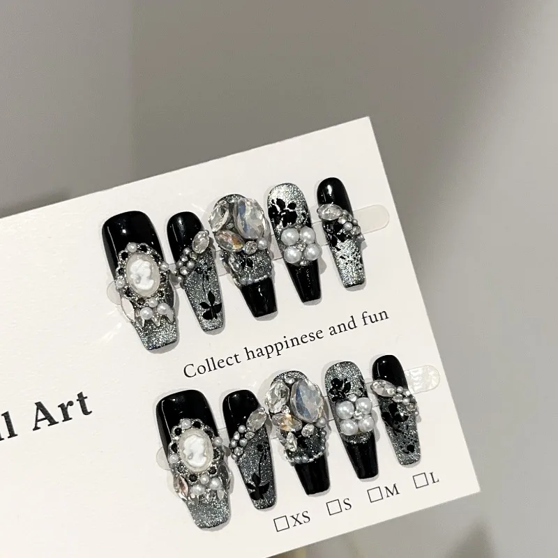 10pcs Handmade Nails Black and Silver Cat-eye Long Nails with Full Diamond Embellishment and A Sturdy Press-on Design
10pcs Handmade Nails Black and Silver Cat-eye Long Nails with Full Diamond Embellishment and A Sturdy Press-on Design