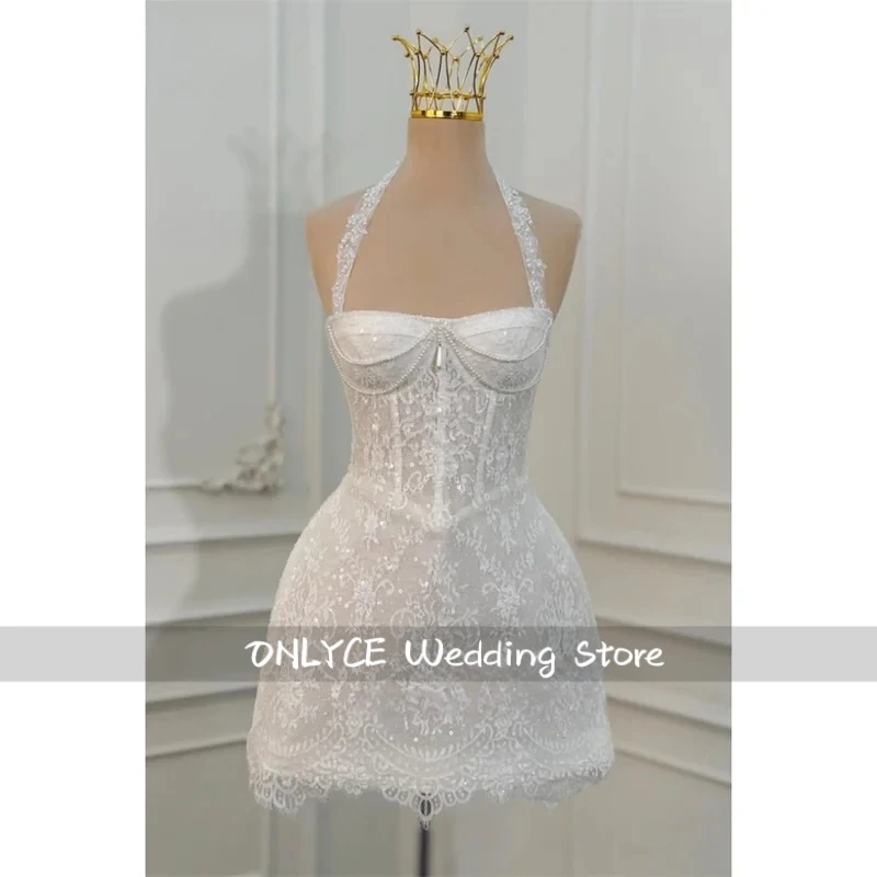 Customized White A-Line Lace Wedding Dress Halter Necklink Sleeveless Zip Back vestidos de noche Mini robe de mariée 2026
Customized White A-Line Lace Wedding Dress Halter Necklink Sleeveless Zip Back vestidos de noche Mini robe de mariée 2026