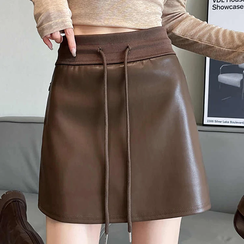 Autumn Winter Vintage Pu Leather Skirts Women Drawstring High Waist A-line Mini Skirt Sexy Club Wear Female Short Leather Skirts
Autumn Winter Vintage Pu Leather Skirts Women Drawstring High Waist A-line Mini Skirt Sexy Club Wear Female Short Leather Skirts
