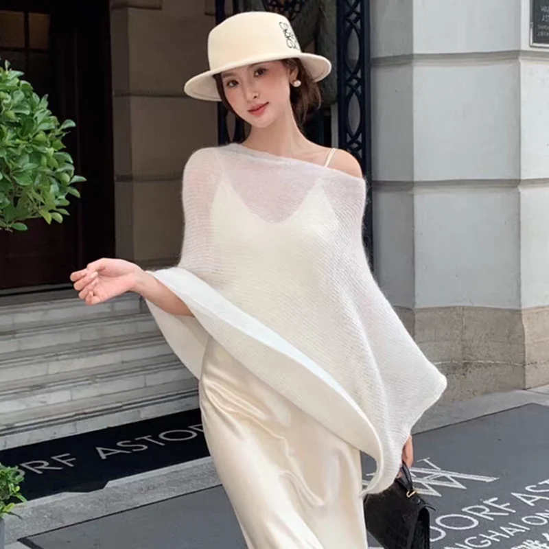Retro Thin Shoulder Slant Sleeveless Knitted Sweater Women Summer New Loose Irregular Cloak Top Trendy Korean Style
Retro Thin Shoulder Slant Sleeveless Knitted Sweater Women Summer New Loose Irregular Cloak Top Trendy Korean Style