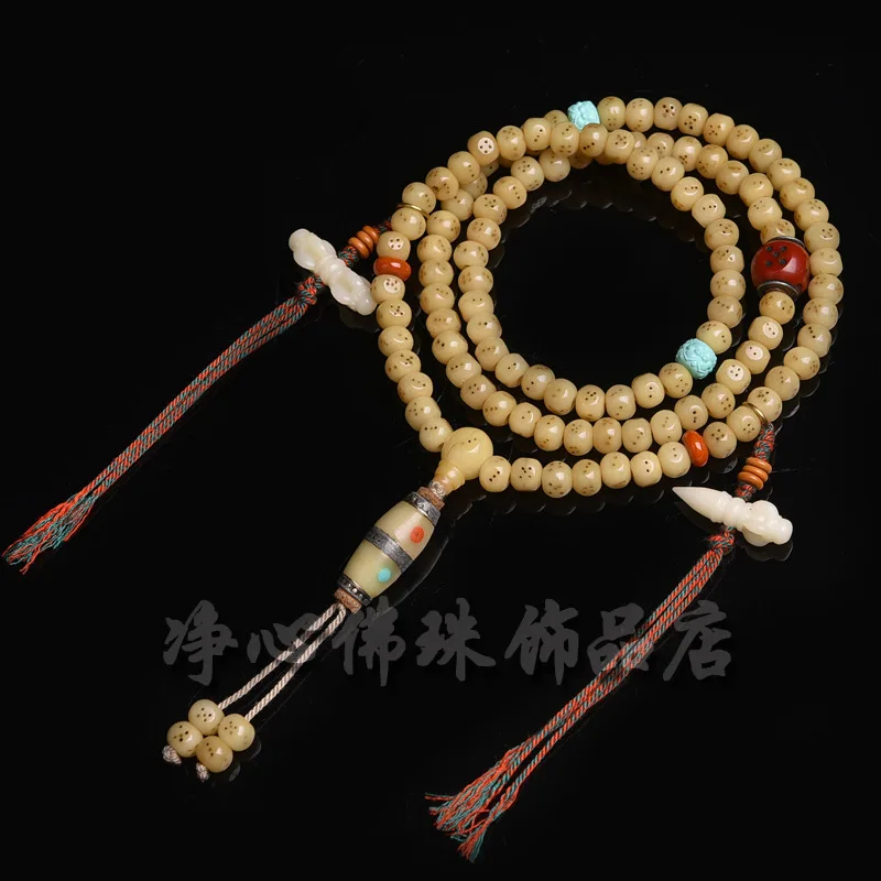 Natural chicken oil yellow camel bone multi-loop bracelet with carved dice pendant, Tibetan style 108-bead Buddhist prayer beads
Natural chicken oil yellow camel bone multi-loop bracelet with carved dice pendant, Tibetan style 108-bead Buddhist prayer beads