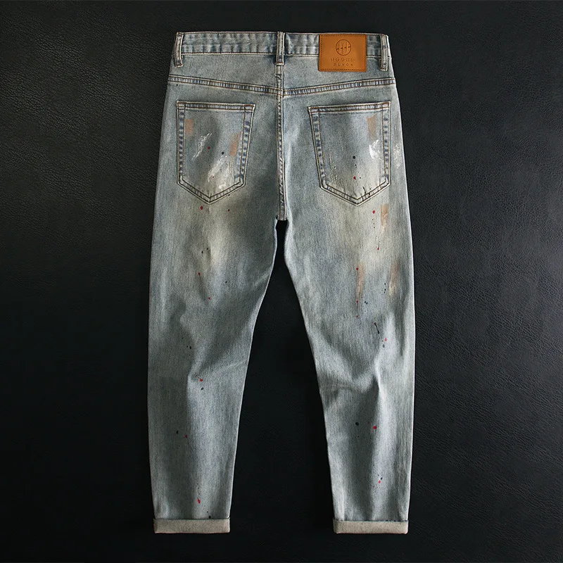 Graffiti ripped jeans men's fashion painted splashed ink print small feet elastic retro pants
Graffiti ripped jeans men's fashion painted splashed ink print small feet elastic retro pants