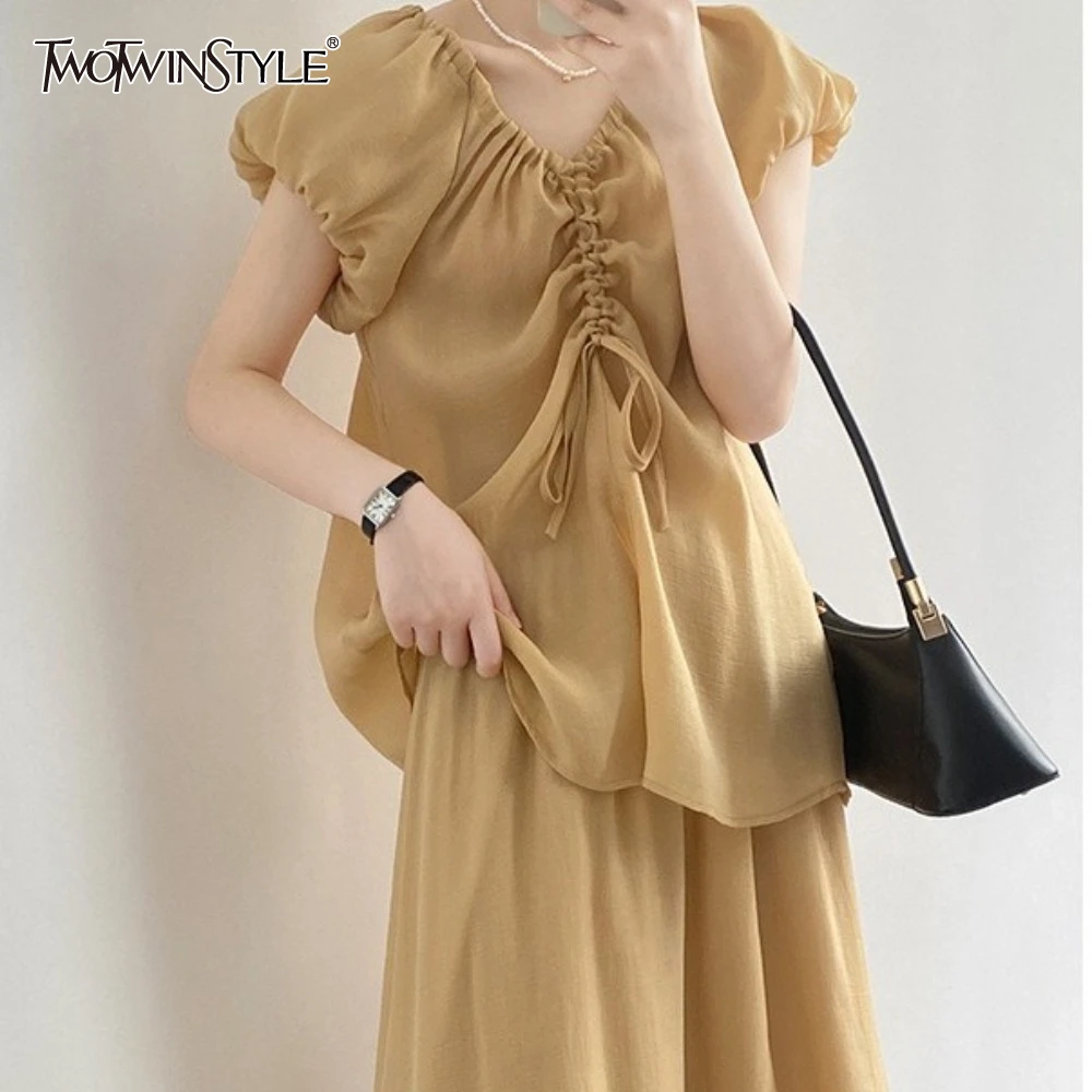 TWOTWINSTYLE Solid Elegant Two Piece Set for Women O Neck Sleeveless Top High Waist Skirt Loose Sets Female Fashion Style
TWOTWINSTYLE Solid Elegant Two Piece Set for Women O Neck Sleeveless Top High Waist Skirt Loose Sets Female Fashion Style