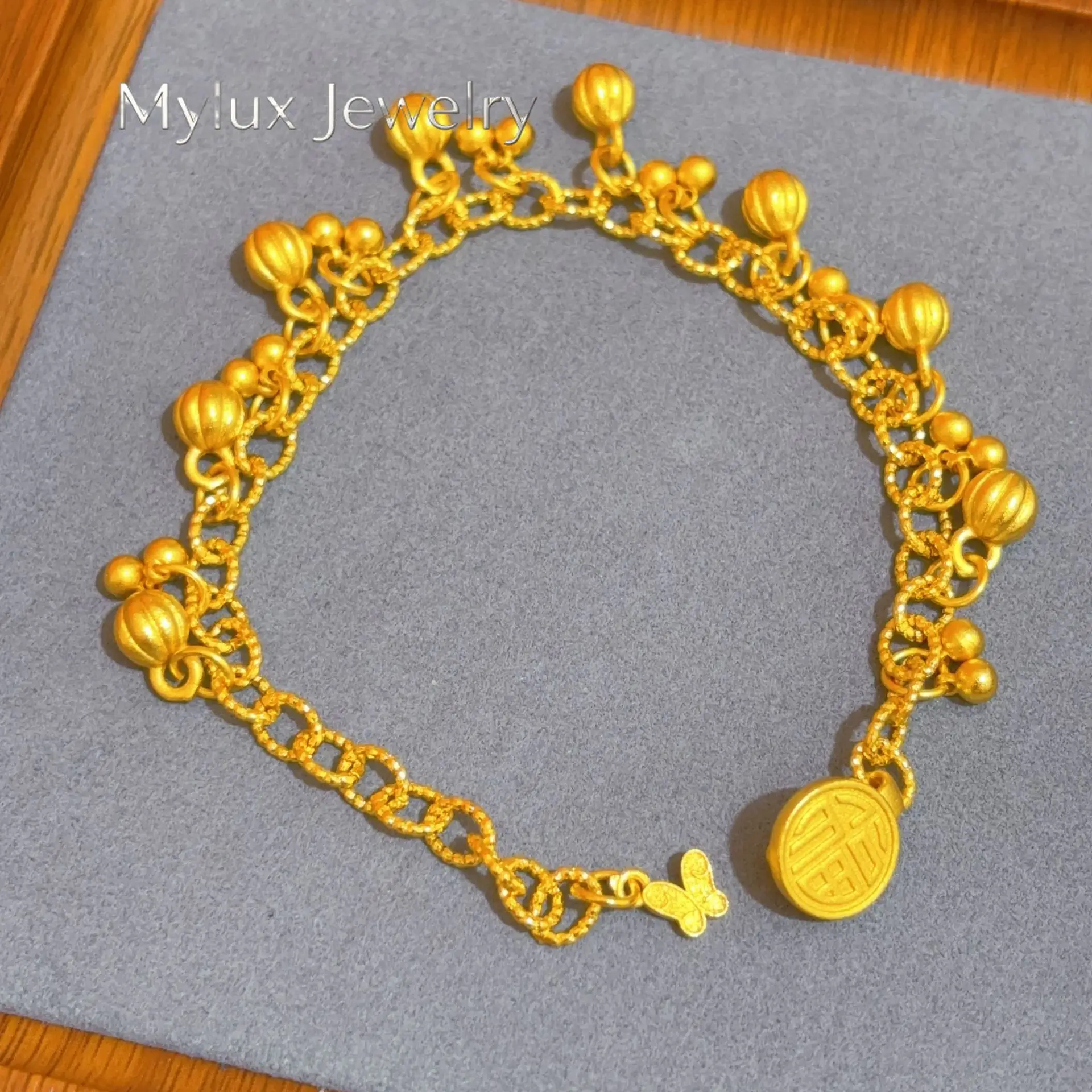 Mylux Jewelry Women's 24K Gold (AU999) Exotic Bell Fruit Bracelet | Gradient matte bell, hammered glow with enamel pattern
Mylux Jewelry Women's 24K Gold (AU999) Exotic Bell Fruit Bracelet | Gradient matte bell, hammered glow with enamel pattern