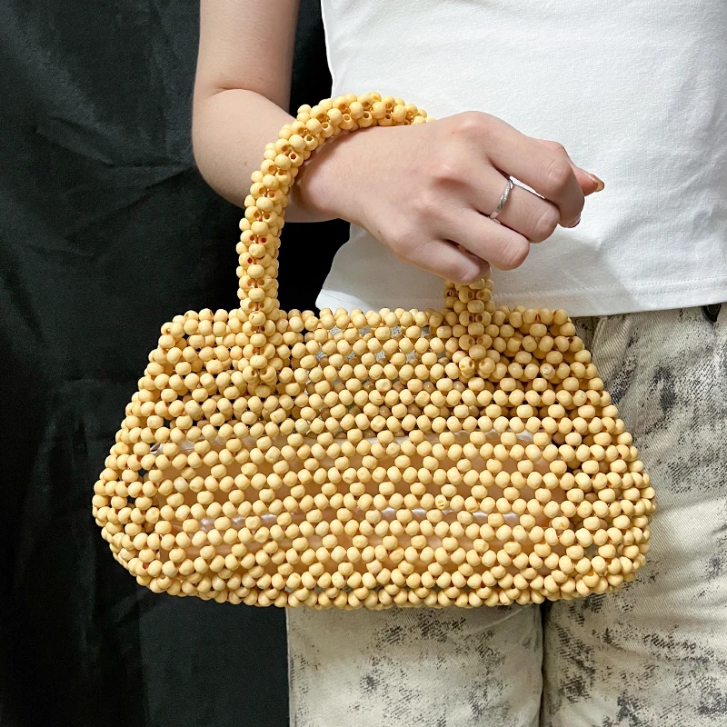 Casual Minimalist Versatile Handmade Wooden Beaded Beach Bag Sand Sandals Woven Handbag for Women
Casual Minimalist Versatile Handmade Wooden Beaded Beach Bag Sand Sandals Woven Handbag for Women