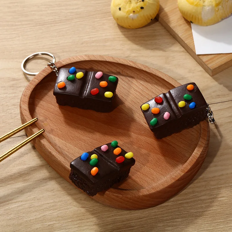 Simulated Food Play Pvc Sugar Bean Chocolate Cake Keychain Pendant Student Fashion Personalized Bag Hanging Decoration
Simulated Food Play Pvc Sugar Bean Chocolate Cake Keychain Pendant Student Fashion Personalized Bag Hanging Decoration