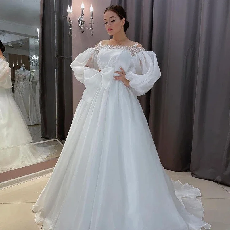 Свадебные платья с белым бантом и вырезом лодочкой на шнуровке, платье невесты в стиле бохо, рукава-фонарики, свадебные платья принцессы трапециевидной формы, большие размеры
Свадебные платья с белым бантом и вырезом лодочкой на шнуровке, платье невесты в стиле бохо, рукава-фонарики, свадебные платья принцессы трапециевидной формы, большие размеры