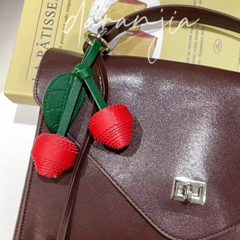 PU Cherry Keychain Leaf Woven Ball Bag Pendant Keyring Fashion Pendant Simple All-matching Bag Decoration Accessories
PU Cherry Keychain Leaf Woven Ball Bag Pendant Keyring Fashion Pendant Simple All-matching Bag Decoration Accessories