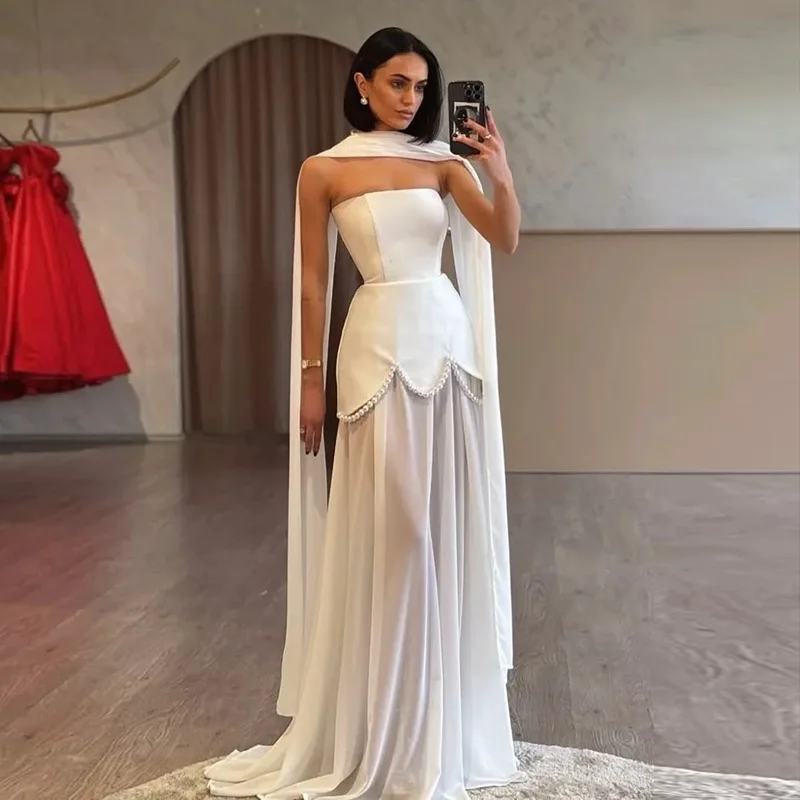 Женское однотонное атласное платье без бретелек без бретелек с жемчужной цепочкой и подолом, вечернее элегантное коктейльное платье с струящимся шлейфом
Женское однотонное атласное платье без бретелек без бретелек с жемчужной цепочкой и подолом, вечернее элегантное коктейльное платье с струящимся шлейфом