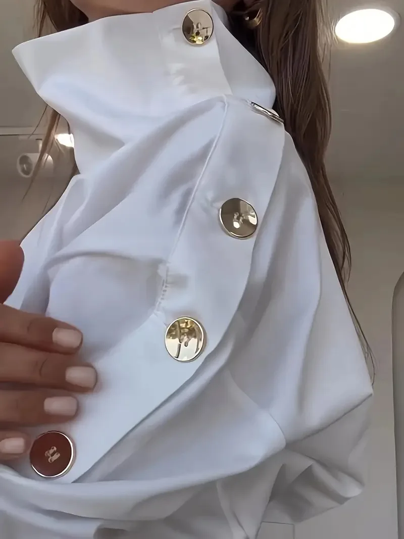 Элегантная блузка с открытыми плечами, шикарная блузка с высоким воротником и металлическими пуговицами, стильная блузка в европейско-американском стиле, приталенная, осенняя.
Элегантная блузка с открытыми плечами, шикарная блузка с высоким воротником и металлическими пуговицами, стильная блузка в европейско-американском стиле, приталенная, осенняя.