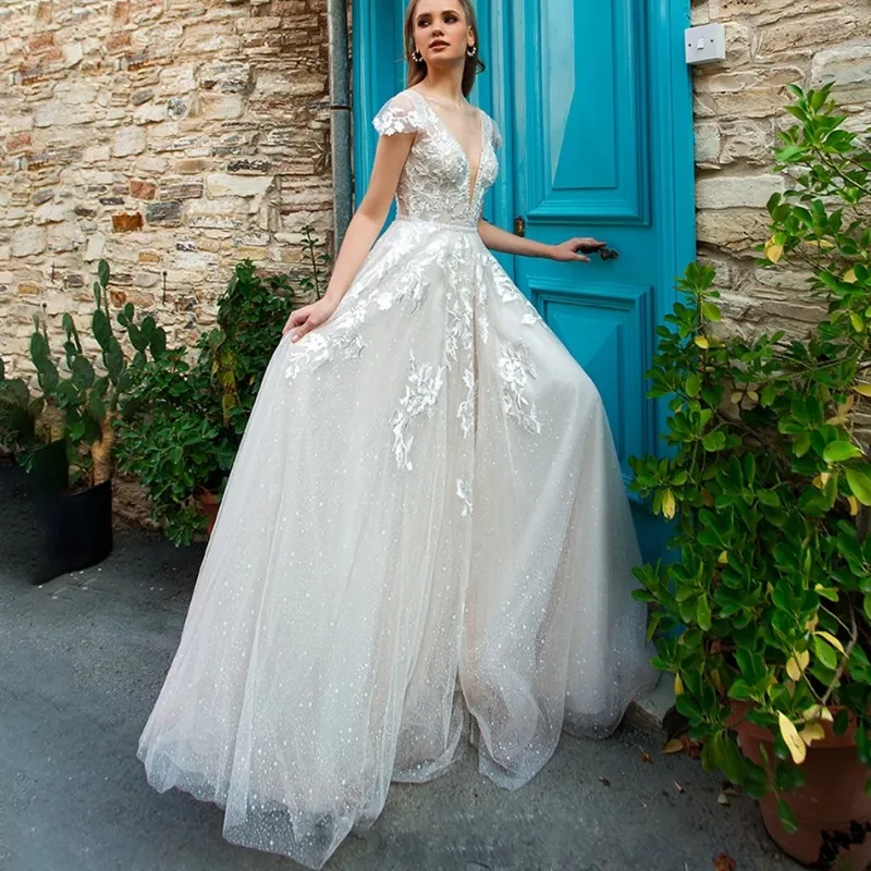 Glitter Lace Appliques Deep V-Neck Short Sleeves A-Line Bridal Gown Backless Tulle Train Sexy Vestido De Novia
Glitter Lace Appliques Deep V-Neck Short Sleeves A-Line Bridal Gown Backless Tulle Train Sexy Vestido De Novia