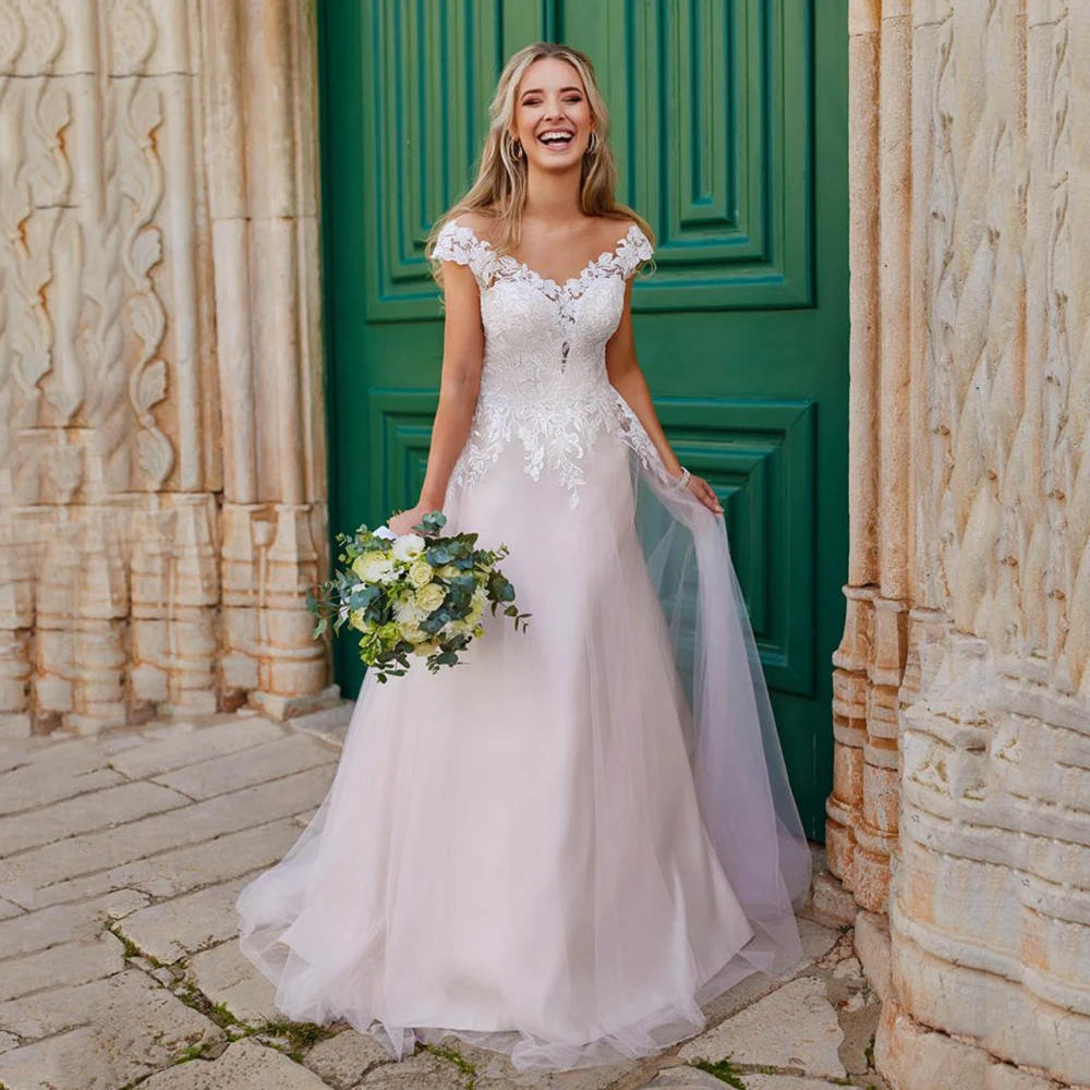 Romantic A Line Wedding Dresses Lace Appliques Cap Sleeves Bridal Dress V Neck Backless Tulle Princess Wedding Gown Customized
Romantic A Line Wedding Dresses Lace Appliques Cap Sleeves Bridal Dress V Neck Backless Tulle Princess Wedding Gown Customized