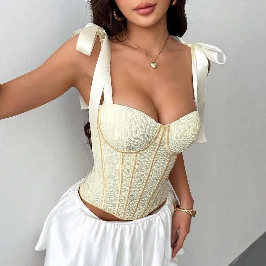 Cream Structured Corset Top With Padded Cups, Adjustable Ribbon Straps, And Vertical Boning For Shaping
Cream Structured Corset Top With Padded Cups, Adjustable Ribbon Straps, And Vertical Boning For Shaping