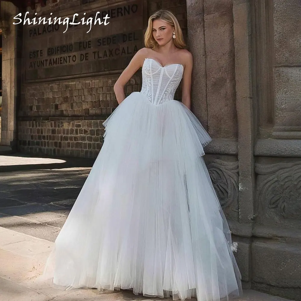 ShiningLight Ruffles Tulle Princess Wedding Dress 2026 Strapless Korea Wedding Dresses Lace Corset Bridal Gown Customized
ShiningLight Ruffles Tulle Princess Wedding Dress 2026 Strapless Korea Wedding Dresses Lace Corset Bridal Gown Customized