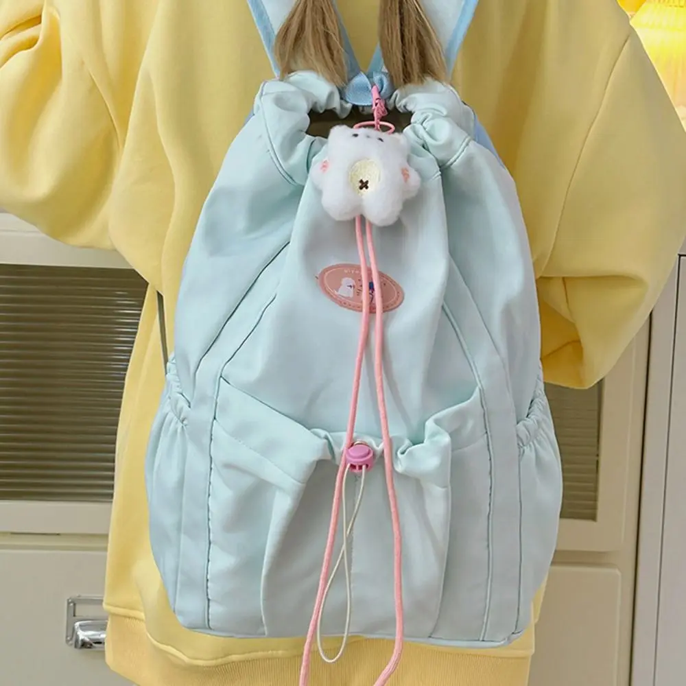 Модный вместительный рюкзак на шнурке, однотонный, с подвеской, школьная сумка, портативная повседневная дорожная сумка для хранения вещей
Модный вместительный рюкзак на шнурке, однотонный, с подвеской, школьная сумка, портативная повседневная дорожная сумка для хранения вещей