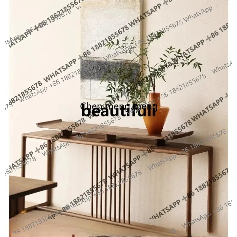 The new Chinese entrance hall for the home is all logs against the wall and long table for
The new Chinese entrance hall for the home is all logs against the wall and long table for