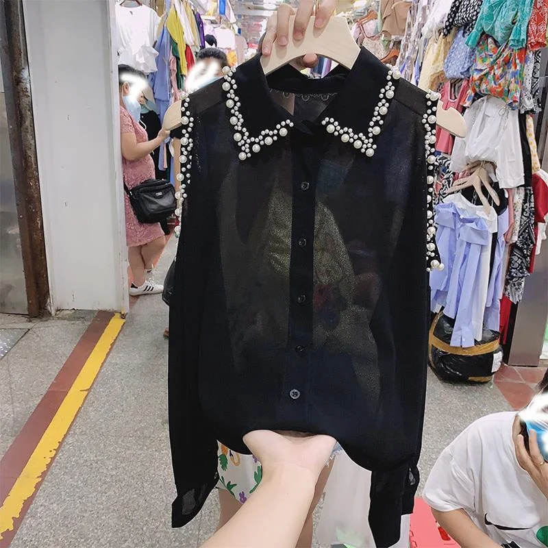 Fashion Women Clothing Thin Pearl Tops Chiffon Loose Off Shoulder Blouse 2025 Spring Summer Lapel Hollow Out Solid Sexy Shirt To
Fashion Women Clothing Thin Pearl Tops Chiffon Loose Off Shoulder Blouse 2025 Spring Summer Lapel Hollow Out Solid Sexy Shirt To