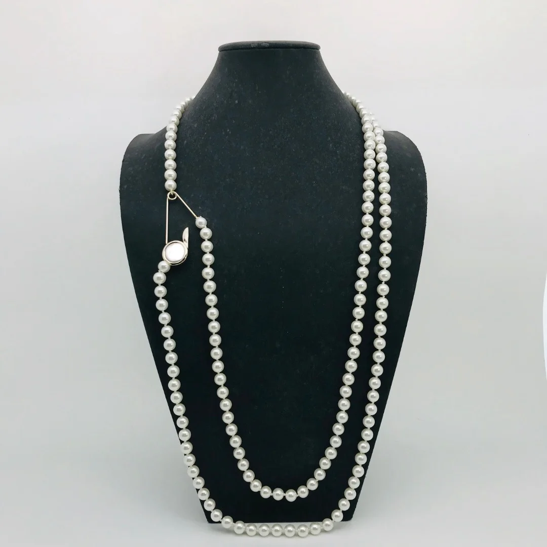 Personality fashion niche simple retro double pearl chain pin style long necklace
Personality fashion niche simple retro double pearl chain pin style long necklace