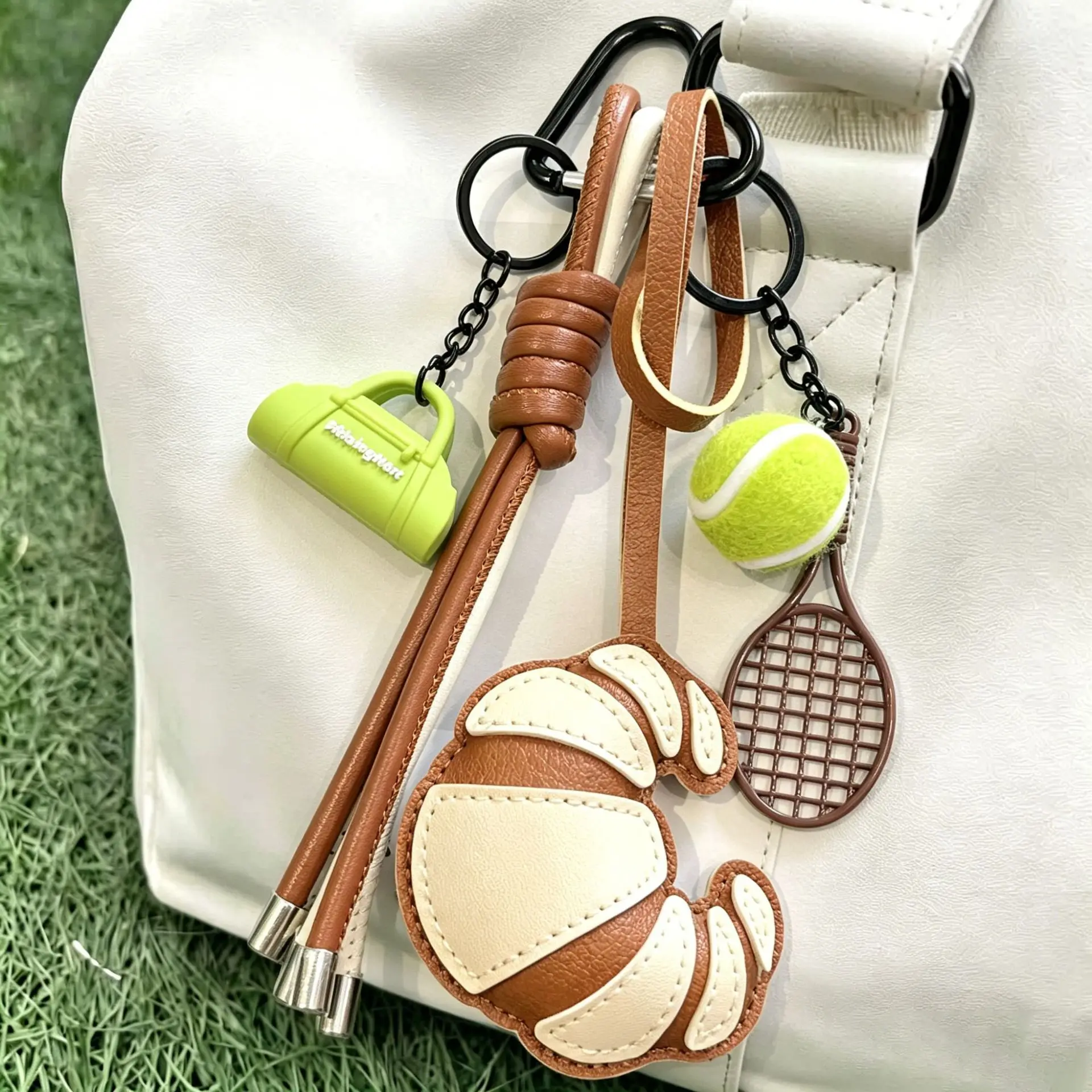 Braided Rope Tennis Leather Keyring Handbag Charms Tennis Racket Croissants Keychains Unique Purse Bag Key Accessories For Women
Braided Rope Tennis Leather Keyring Handbag Charms Tennis Racket Croissants Keychains Unique Purse Bag Key Accessories For Women
