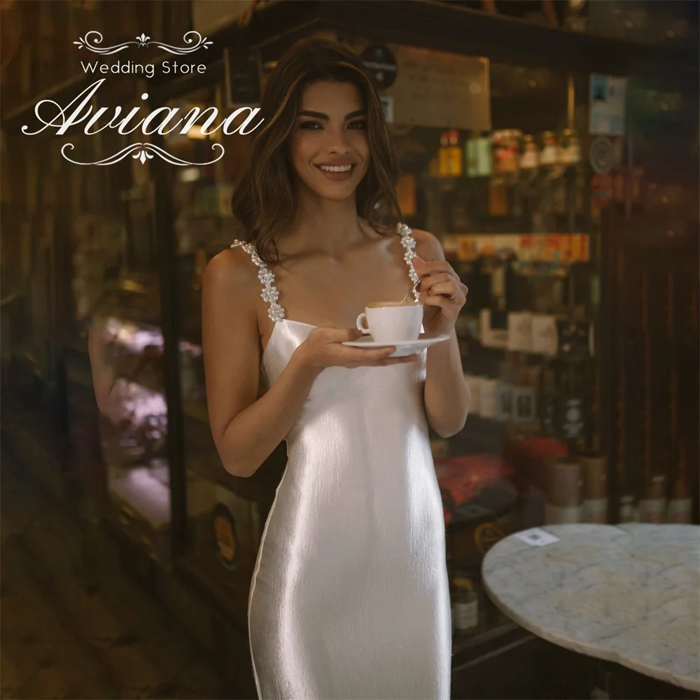 Aviana Customized Mermaid Stain Wedding Dress Spaghetti Strap Boat Neck Sweep Train Backless Pearls Flower Simple Elegant 2025
Aviana Customized Mermaid Stain Wedding Dress Spaghetti Strap Boat Neck Sweep Train Backless Pearls Flower Simple Elegant 2025