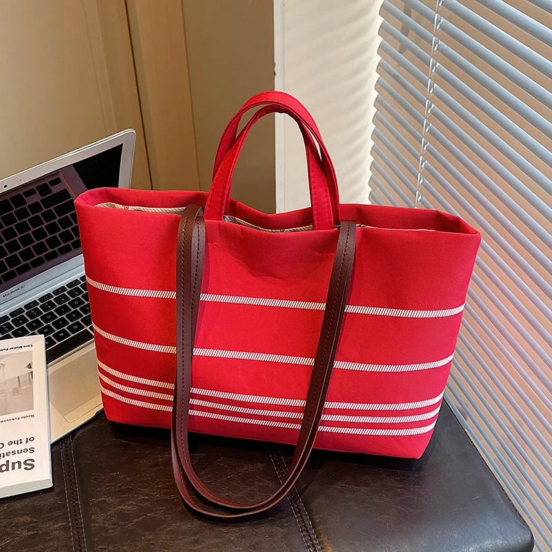 Large Capacity Canvas Tote Bag Women's 2026 New Fashion Versatile INS Stripe Handbag Casual Commuting Tote Bag
Large Capacity Canvas Tote Bag Women's 2026 New Fashion Versatile INS Stripe Handbag Casual Commuting Tote Bag