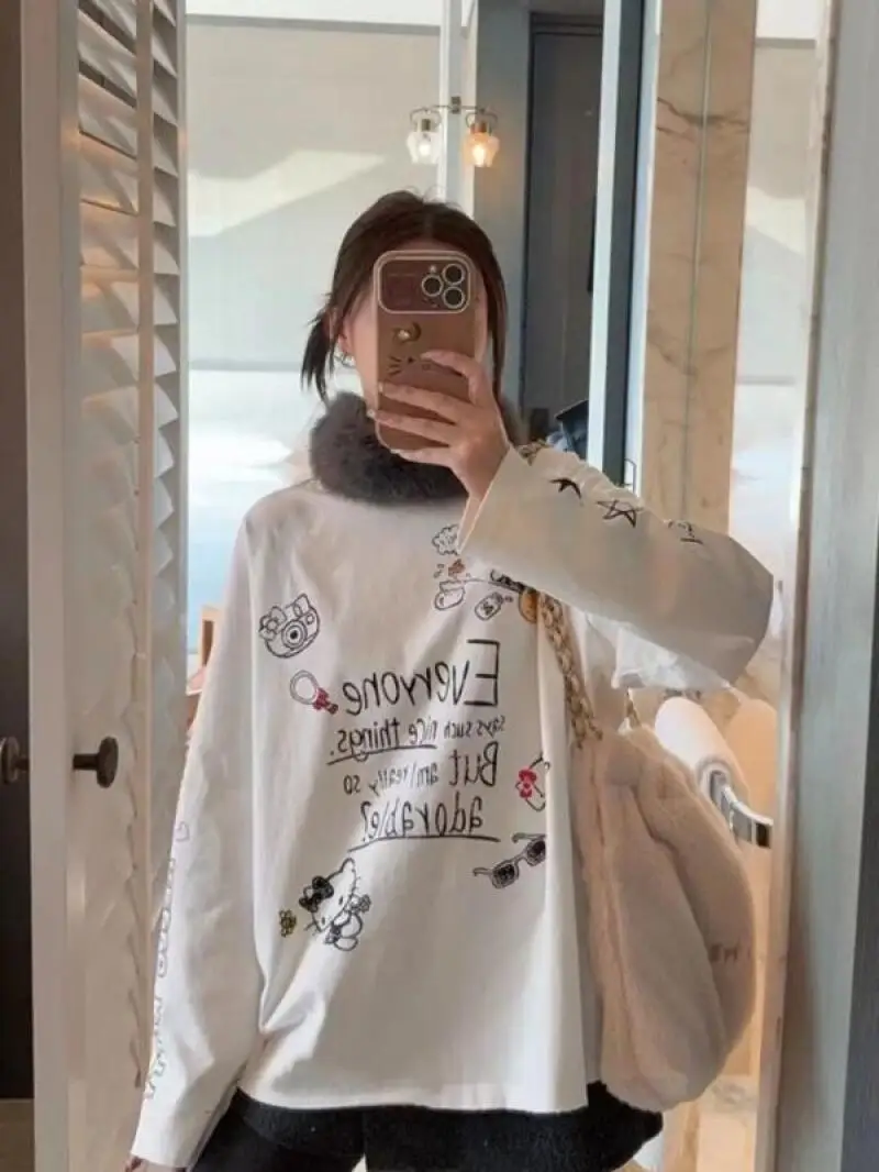 Футболка с длинными рукавами Y2K Sanrio Hello Kitty, женская повседневная одежда с мультяшным рисунком, простой американский дизайн с графическим принтом, футболка Kawaii для девочек, топы
Футболка с длинными рукавами Y2K Sanrio Hello Kitty, женская повседневная одежда с мультяшным рисунком, простой американский дизайн с графическим принтом, футболка Kawaii для девочек, топы