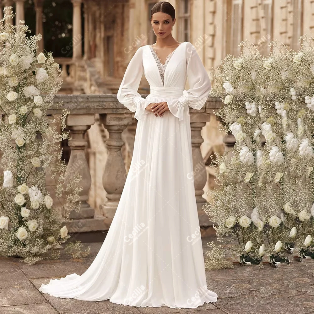 Элегантные свадебные платья из шифона, фасон А-силуэт, с длинными пышными рукавами, глубоким V-образным вырезом, изящные, на заказ, Vestidos De Novia
Элегантные свадебные платья из шифона, фасон А-силуэт, с длинными пышными рукавами, глубоким V-образным вырезом, изящные, на заказ, Vestidos De Novia