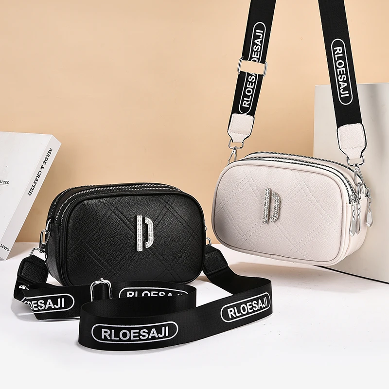 2025 Fashion Trend Small Shoulder Bag Black White Color Grid Pattern PU Leather Camera Bag Wide Strip Female Cross Body Bag
2025 Fashion Trend Small Shoulder Bag Black White Color Grid Pattern PU Leather Camera Bag Wide Strip Female Cross Body Bag
