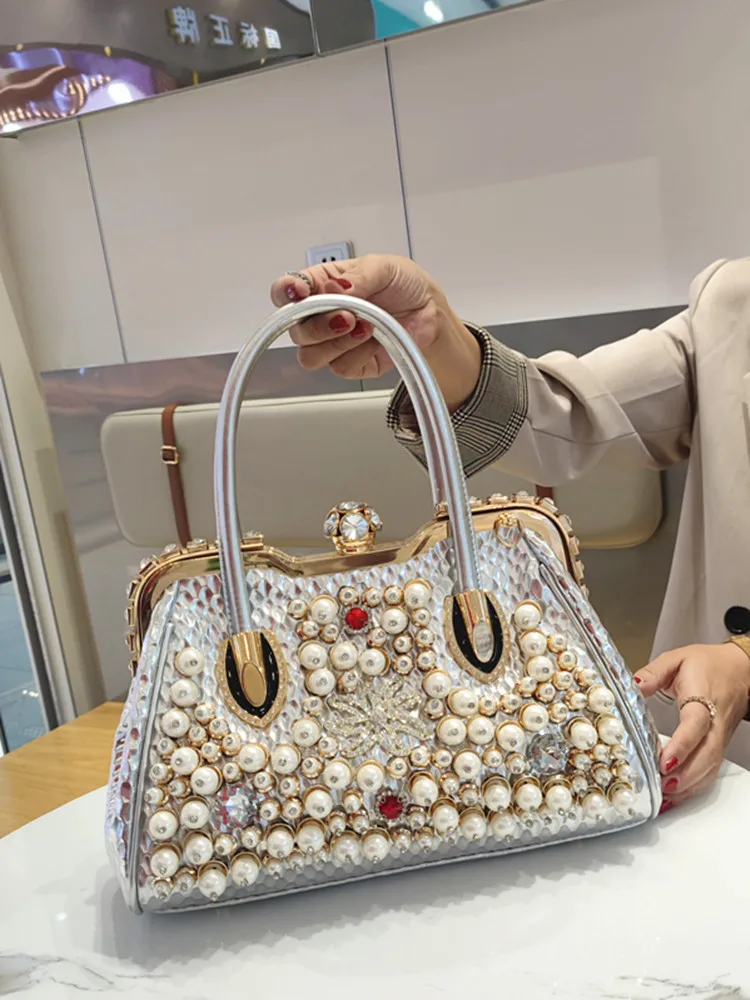 Модная женская сумка Ele Pearl Faion с бриллиантовой инкрустацией, повседневная кожаная сумка через плечо в форме ракушки
Модная женская сумка Ele Pearl Faion с бриллиантовой инкрустацией, повседневная кожаная сумка через плечо в форме ракушки